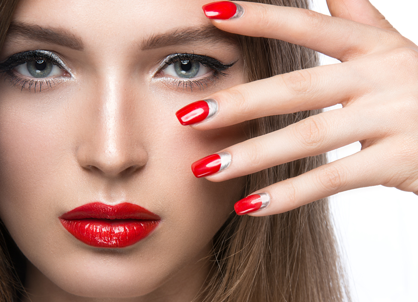 Beautiful Young Girl with a Bright Make-up and Red Nails. Beauty Face.